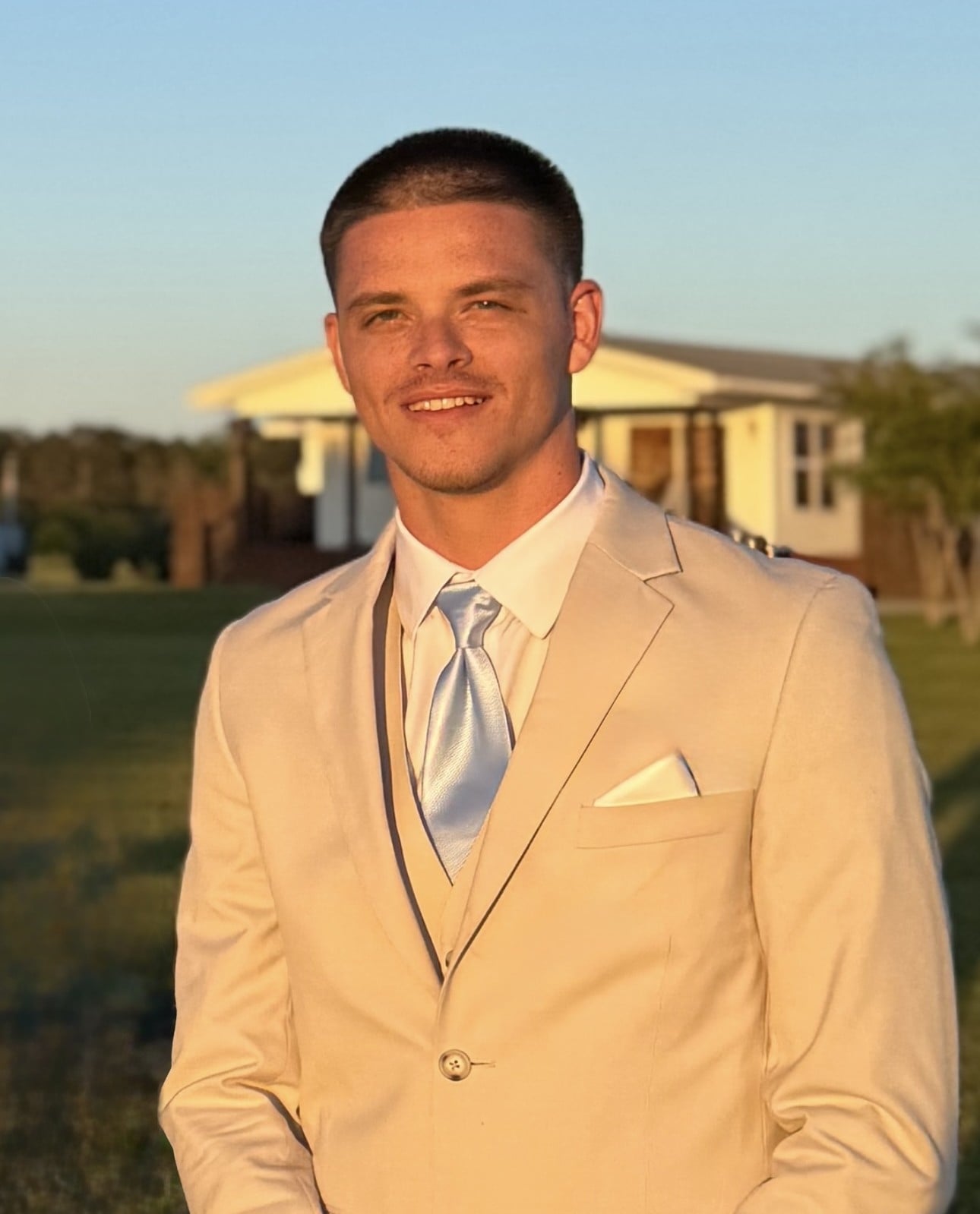 Logan Meriwether smiling against a neutral background